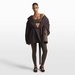 NWOT Nike Skims wrap coat $188 retail
Phoenix Med